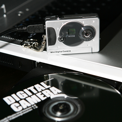 DIGITECH® Mini Digital Camera - Take up to 26 photos with this convenient camera.  Includes USB cable, fun editing software, key ring and carrying case.  Not compatible with Windows Vista.